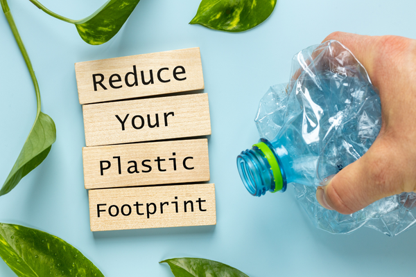 Reduce your plastic footprint text with a water bottle 